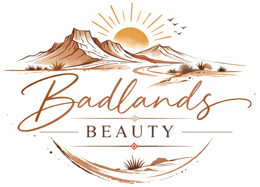 Badlands Beauty logo featuring desert mountains, sun and birds with the brand name in cursive text.','Desert landscape logo for Badlands Beauty with sun, mountains, and decorative typography.','Badge-style logo: 'Badlands Beauty' with a desert scene and decorative lines.','Brand logo for Badlands Beauty showing a sunlit desert landscape and flowing script.','Logo of Badlands Beauty with desert mountains, sun, and elegant script typography.